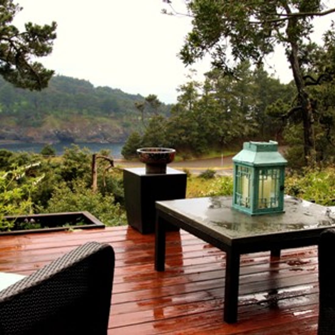Deck table and lantern looking out over the cove