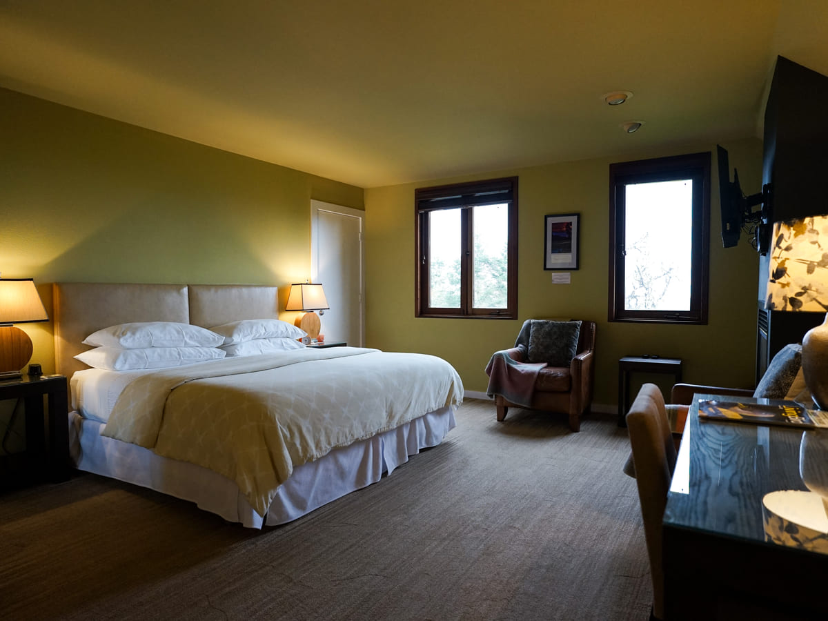 A guest room at Brewery Gulch Inn with fireplace and ocean-facing windows